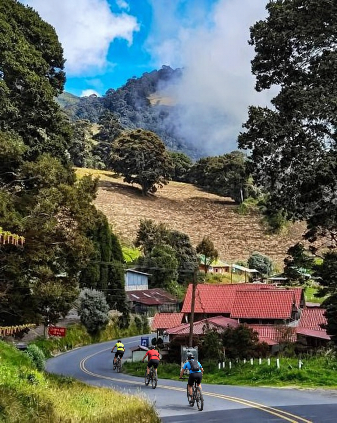 Cyclists descending from Irazú Volcano during a Costa Rica coast-to-coast bicycle tour